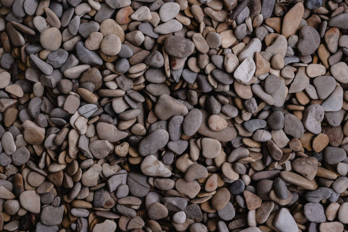 Smooth river rock pebbles in grays and browns